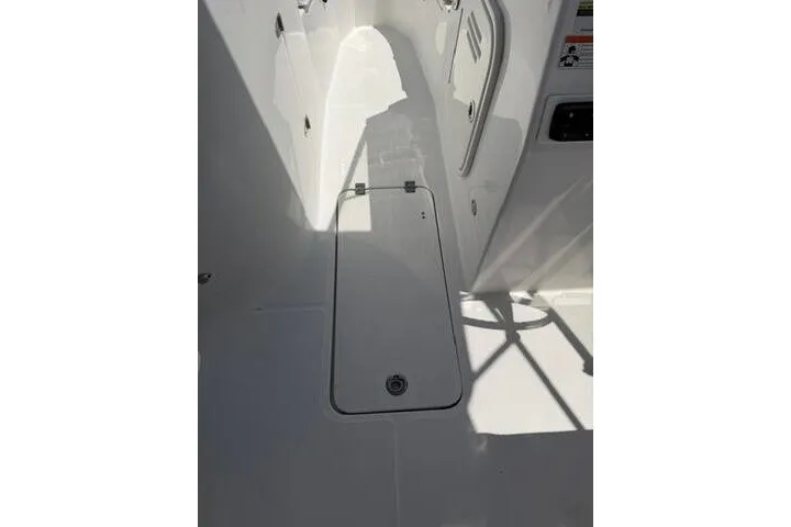 Slide: The Image of 2008 Sea Pro 228 Dual Console boat interior with storage compartment. - 30