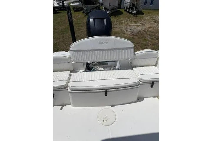 Slide: The Image of 2008 Sea Pro 228 Dual Console boat with white seating and outboard motor. - 21