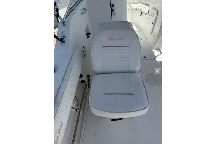 Slide: The Image of White seating on 2008 Sea Pro 228 Dual Console boat interior. - 26