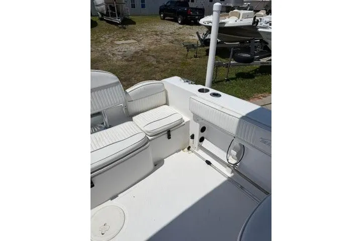 Slide: The Image of 2008 Sea Pro 228 Dual Console boat interior with white seating and deck. - 22