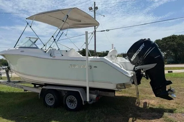 Slide: The Image of 2008 Sea Pro 228 Dual Console boat on trailer with Mercury outboard motor. - 5