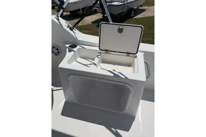 Slide: The Image of 2008 Sea Pro 228 Dual Console boat with open storage compartment on deck. - 27