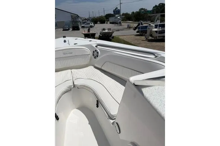 Slide: The Image of 2008 Sea Pro 228 Dual Console boat with white seating and spacious deck area. - 13