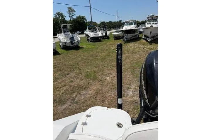 Slide: The Image of 2008 Sea Pro 228 Dual Console boat in a grassy lot with other boats. - 35