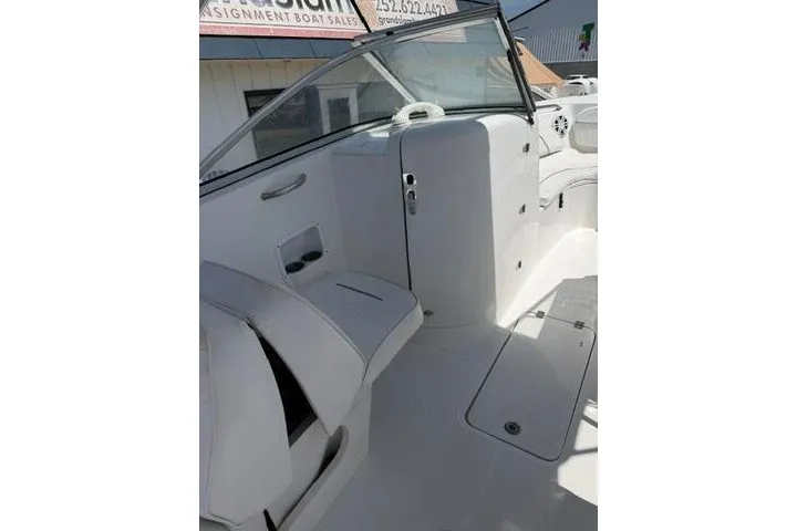 Slide: The Image of 2008 Sea Pro 228 Dual Console boat interior with seating and storage compartments. - 29
