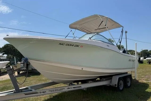 Slide: The Image of 2008 Sea Pro 228 Dual Console boat on trailer, parked outdoors under clear sky. - 4