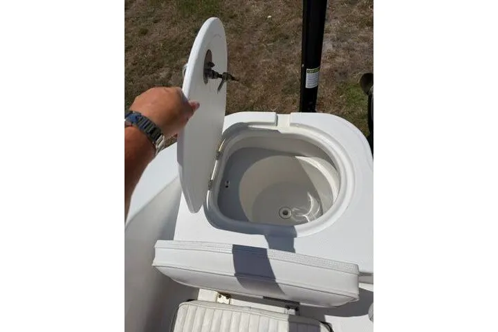 Slide: The Image of Open storage compartment on 2008 Sea Pro 228 Dual Console boat. - 23