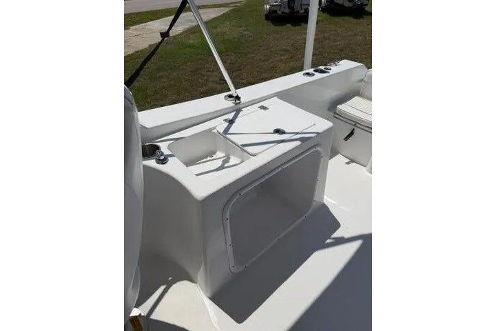 Slide: The Image of 2008 Sea Pro 228 Dual Console boat interior with storage compartment and seating. - 19
