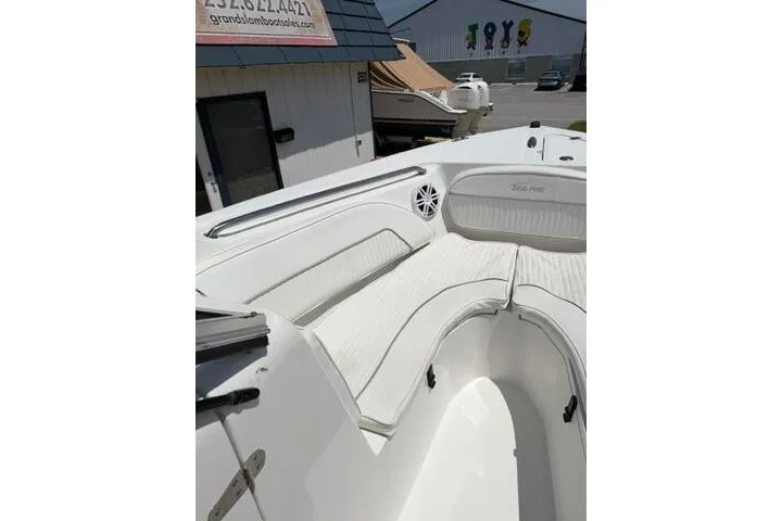 Slide: The Image of 2008 Sea Pro 228 Dual Console boat with white seating and sleek design. - 12