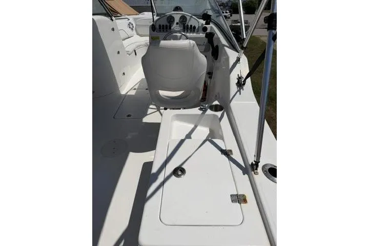 Slide: The Image of 2008 Sea Pro 228 Dual Console boat interior with white seating and control panel. - 36