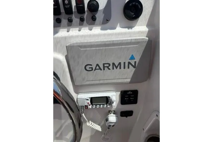 Slide: The Image of Garmin navigation system on 2008 Sea Pro 228 Dual Console boat dashboard. - 33