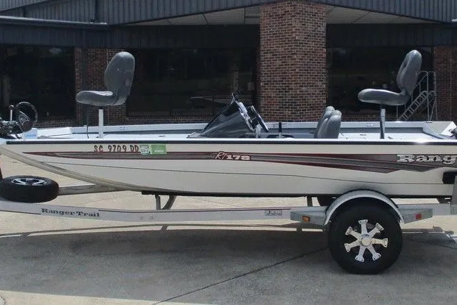 The Image of 2016 Ranger RT178 fishing boat on trailer, side view, parked outdoors. - 1