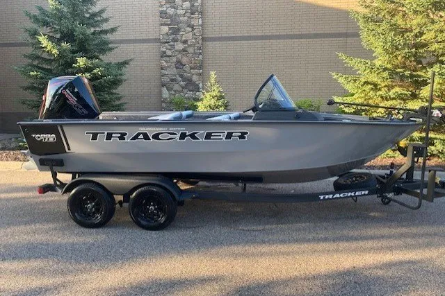 The Image of 2027 Tracker TARGA18WT TE boat on trailer, parked outdoors. - 1