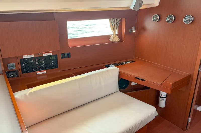 Slide: The Image of Interior of 2021 Beneteau Oceanis 41.1 yacht with navigation station and seating area. - 37