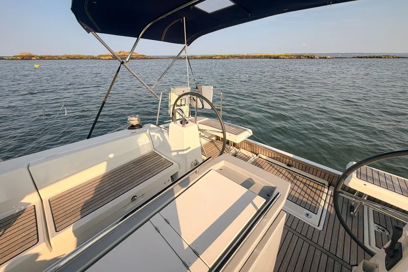 Slide: The Image of Cockpit view of 2021 Beneteau Oceanis 41.1 sailboat on calm water. - 16