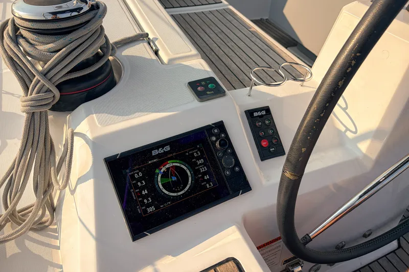 Slide: The Image of Beneteau Oceanis 41.1 yacht cockpit with navigation display and steering wheel, 2021 model. - 27