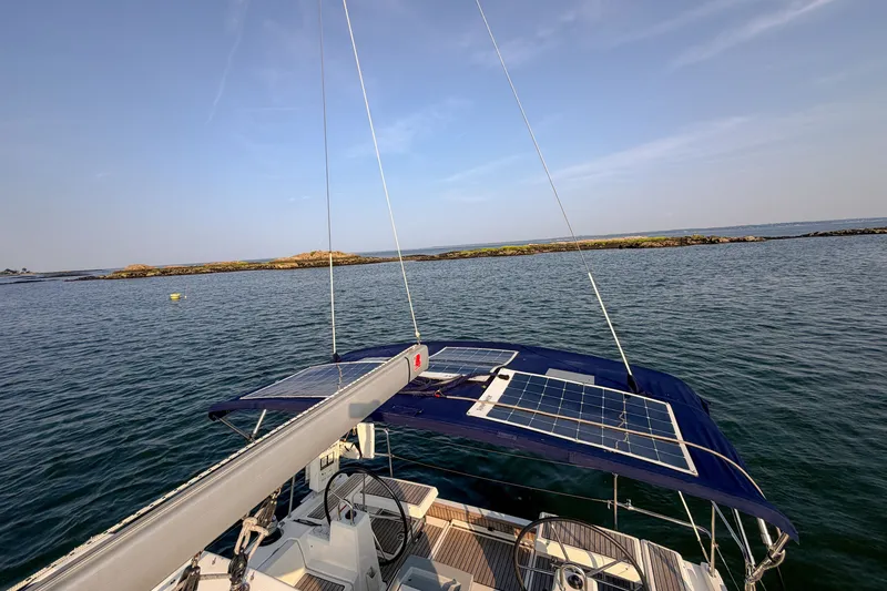 Slide: The Image of Beneteau Oceanis 41.1 sailboat with solar panels, 2021 model, on calm waters. - 28
