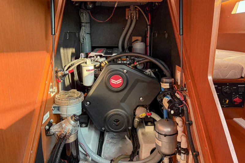 Slide: The Image of Engine compartment of a 2021 Beneteau Oceanis 41.1 sailboat, featuring Yanmar components. - 53