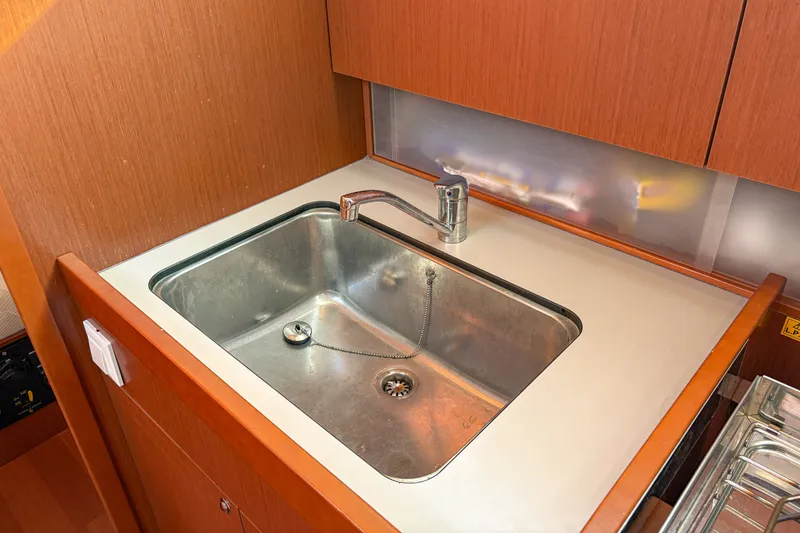 Slide: The Image of Modern kitchen sink in 2021 Beneteau Oceanis 41.1 yacht galley. - 41
