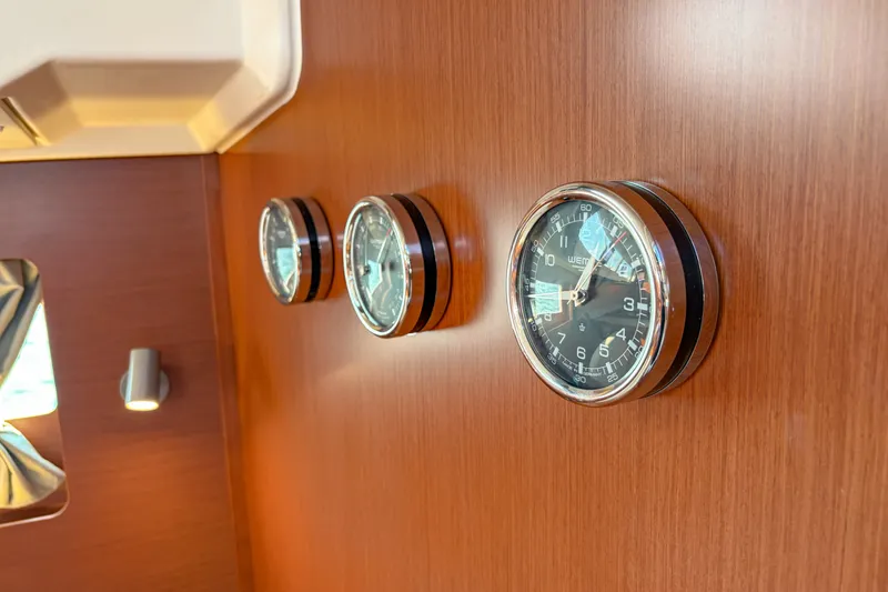Slide: The Image of Interior of 2021 Beneteau Oceanis 41.1 yacht with nautical instruments on wooden panel. - 50