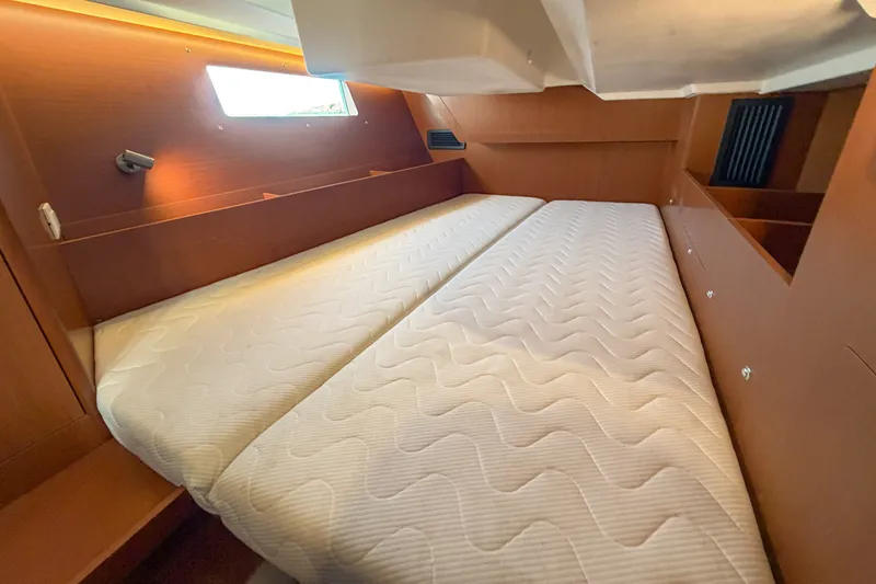Slide: The Image of Interior cabin of 2021 Beneteau Oceanis 41.1 yacht with twin beds and wooden finish. - 47