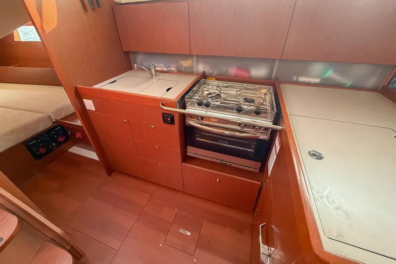 Slide: The Image of Interior of 2021 Beneteau Oceanis 41.1 yacht kitchen with stove and sink. - 39