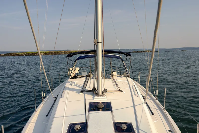 Slide: The Image of 2021 Beneteau Oceanis 41.1 sailboat on calm waters, clear sky, scenic view. - 8