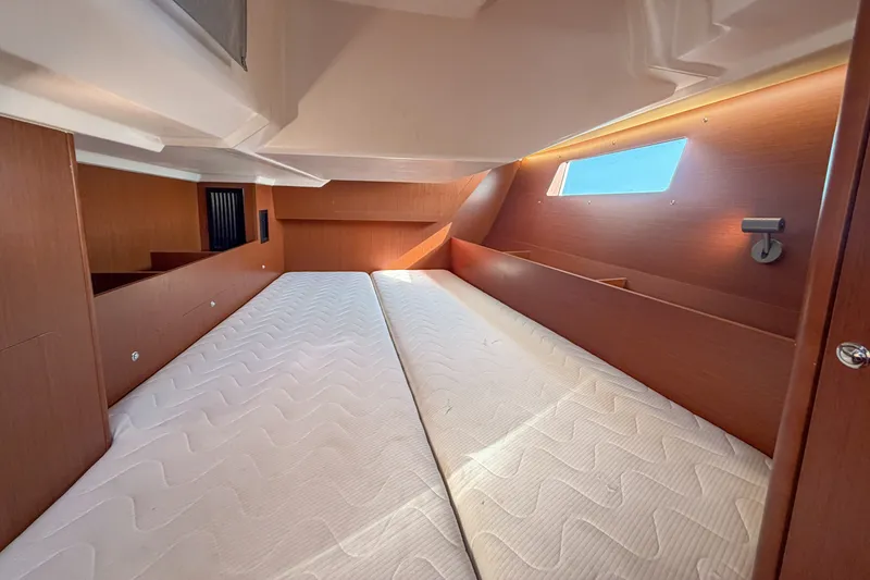 Slide: The Image of Interior cabin of 2021 Beneteau Oceanis 41.1 yacht with twin beds and wooden finish. - 45