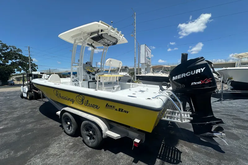 Slide: The Image of 2007 Lake & Bay Backwater 24 boat with Mercury Pro XS engine on trailer. - 2