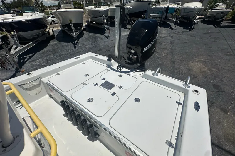 Slide: The Image of 2007 Lake & Bay Backwater 24 boat with Mercury engine in a marina. - 13