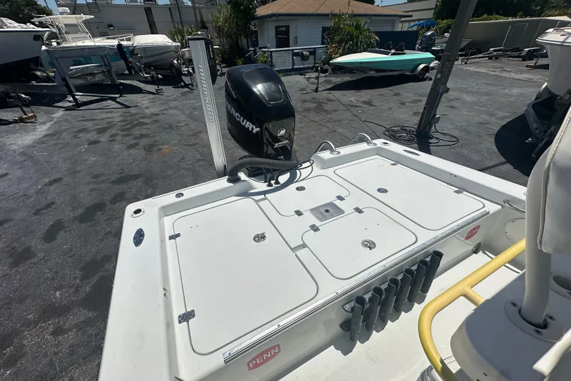 Slide: The Image of 2007 Lake & Bay Backwater 24 boat with Mercury engine in a marina setting. - 12
