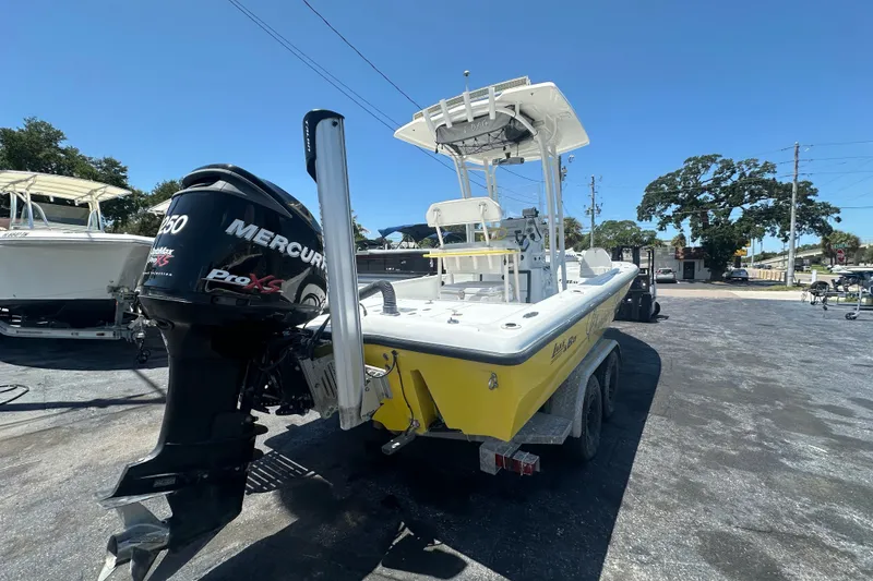 Slide: The Image of 2007 Lake & Bay Backwater 24 boat with Mercury Pro XS engine, parked outdoors. - 4