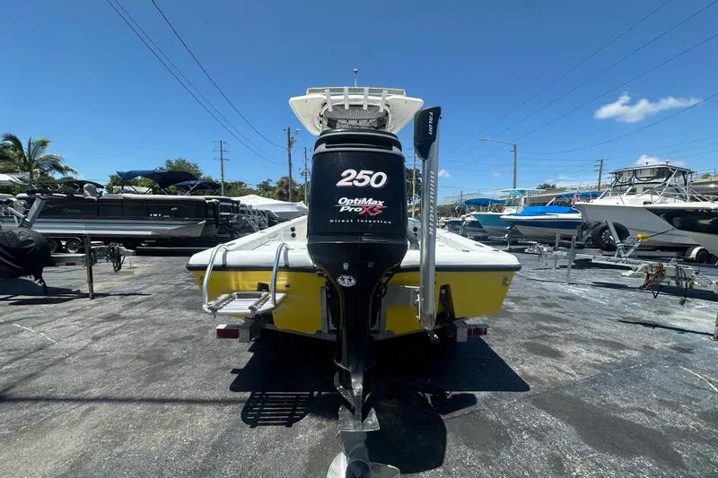 Slide: The Image of 2007 Lake & Bay Backwater 24 boat with 250 OptiMax Pro XS engine in a marina. - 3