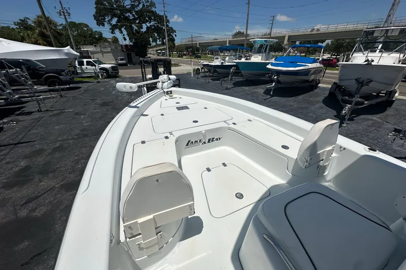 Slide: The Image of 2007 Lake & Bay Backwater 24 boat displayed in a marina setting. - 8