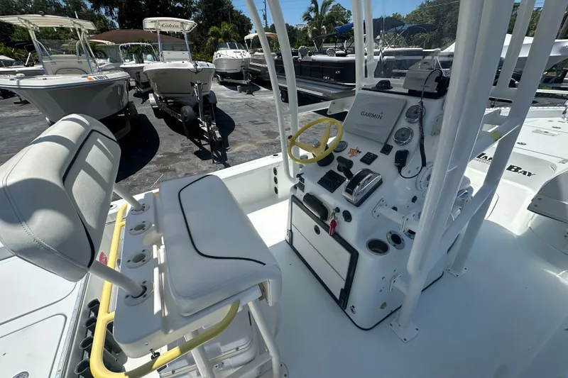 Slide: The Image of 2007 Lake & Bay Backwater 24 boat interior with steering console and seating. - 11