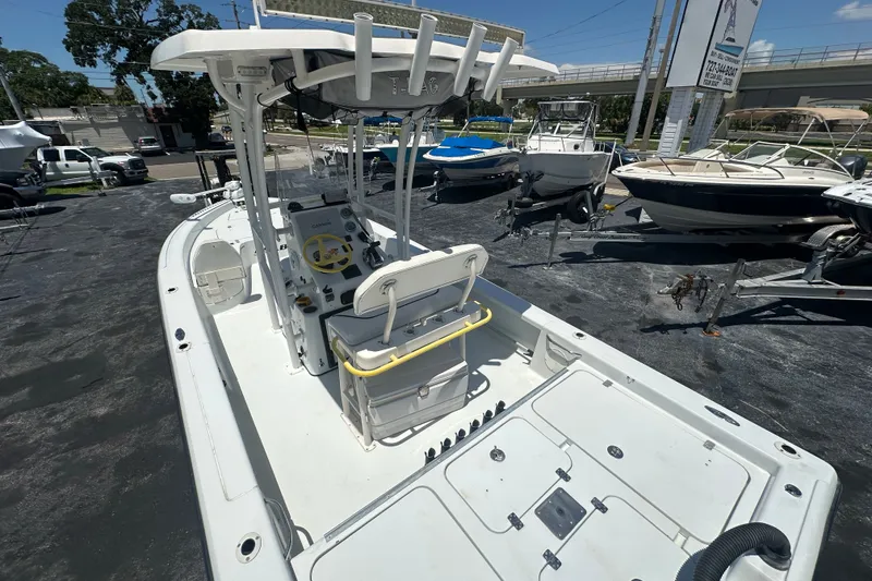 Slide: The Image of A 2007 Lake & Bay Backwater 24 boat with an open deck and helm station. - 14