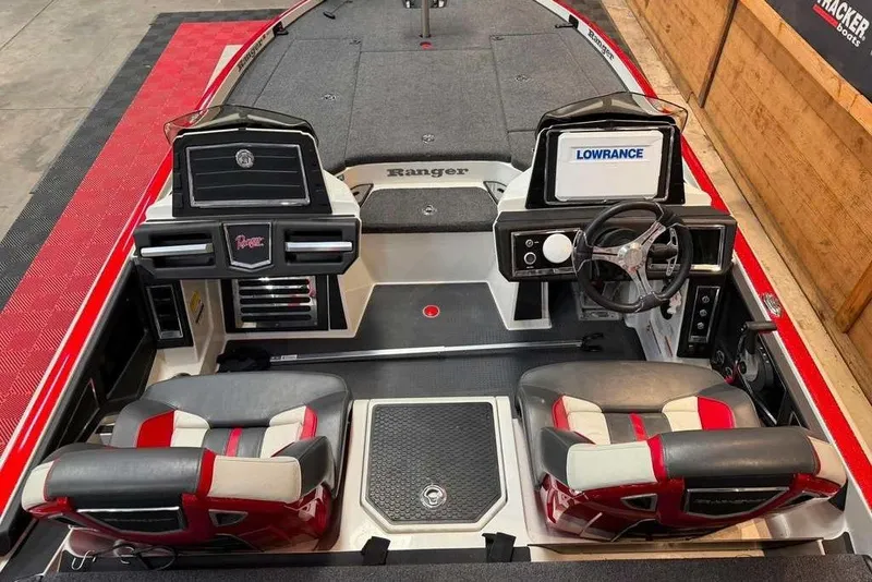 Slide: The Image of 2022 Ranger Z520R boat interior with dual seats, steering wheel, and Lowrance display. - 4