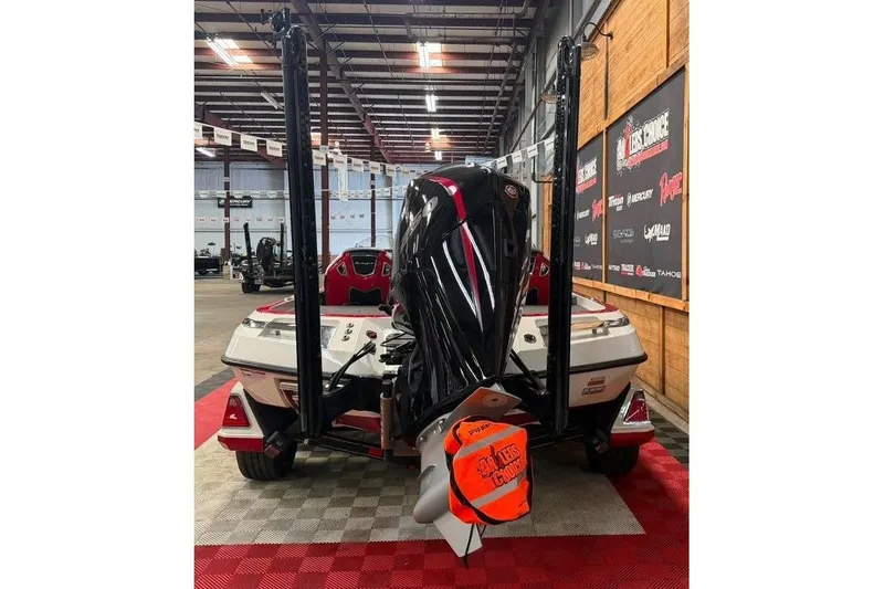Slide: The Image of 2022 Ranger Z520R boat in showroom, rear view with motor and accessories. - 6