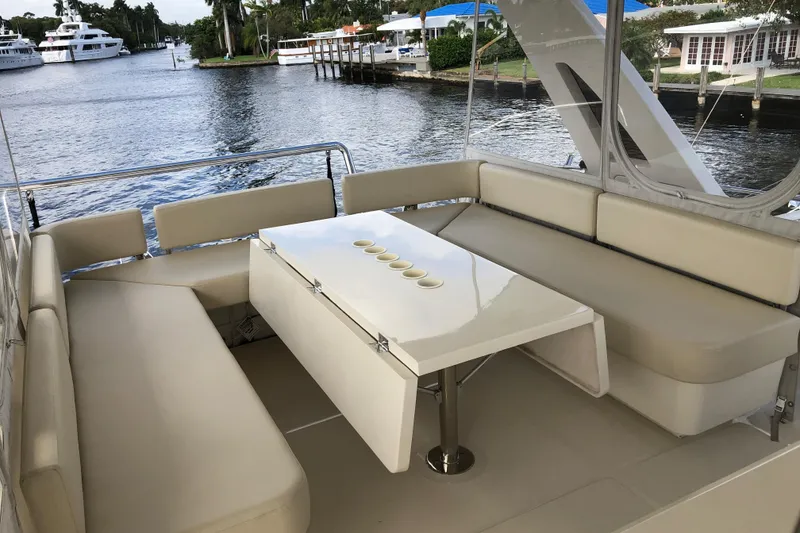 Slide: The Image of Luxurious seating area on a 2016 Aquila 48 yacht, overlooking a serene waterfront. - 10