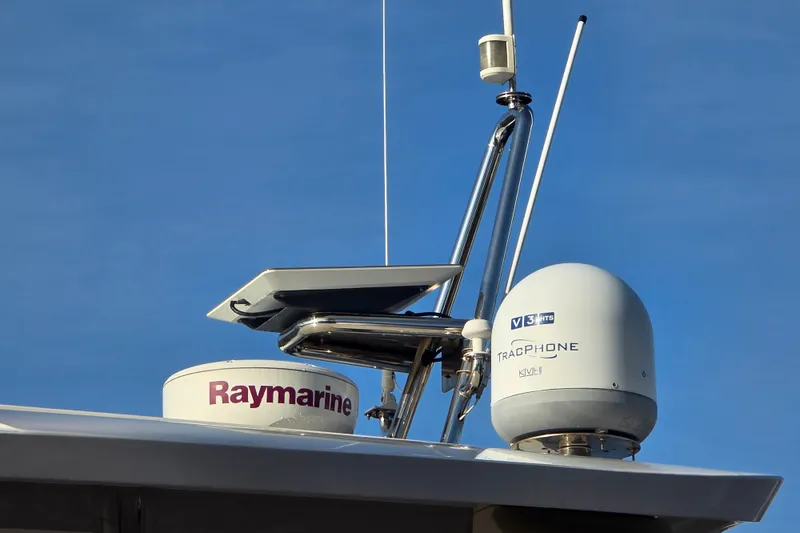 Slide: The Image of Aquila 48 yacht 2016 with Raymarine and TracPhone equipment against clear blue sky. - 14