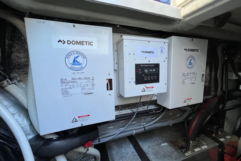 Slide: The Image of Dometic marine equipment in 2016 Aquila 48 yacht engine room, featuring control panels and wiring. - 33