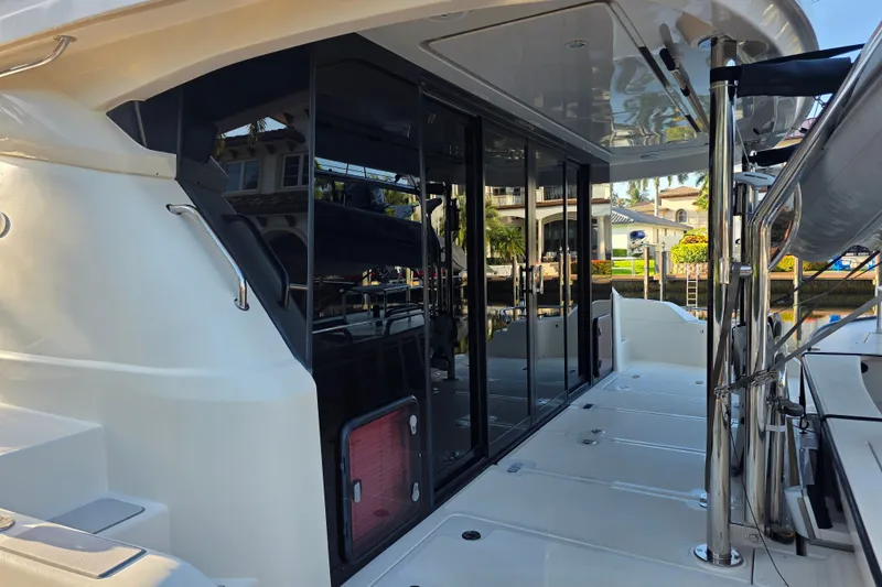 Slide: The Image of Aquila 48 yacht, 2016 model, featuring sleek design and spacious deck area. - 4