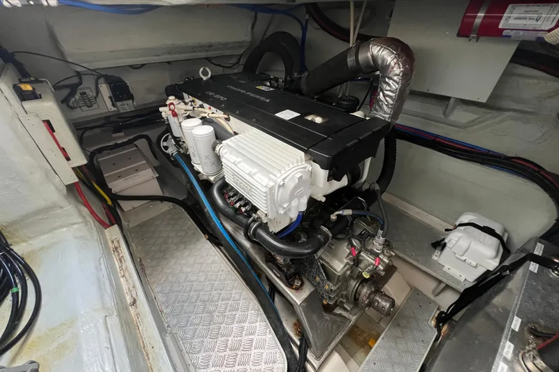Slide: The Image of Engine room of a 2016 Aquila 48 yacht, showcasing detailed mechanical components. - 31