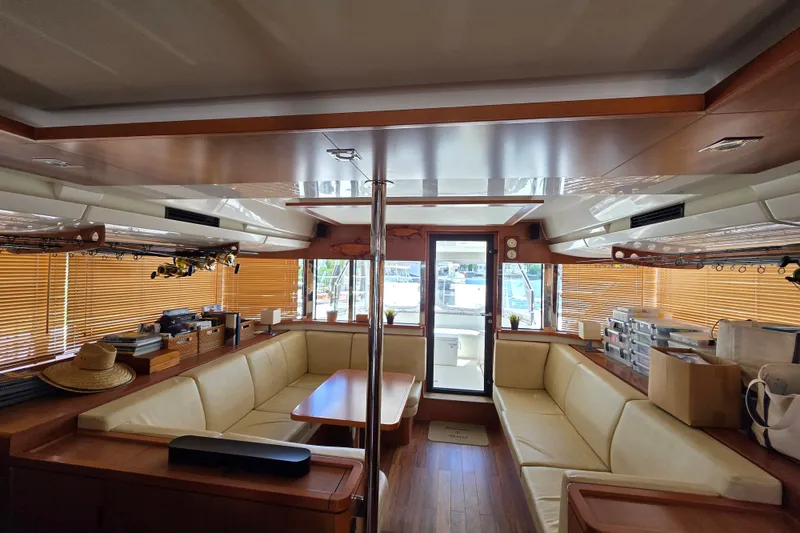 Slide: The Image of Luxurious interior of a 2016 Aquila 48 yacht with beige seating and wooden accents. - 20