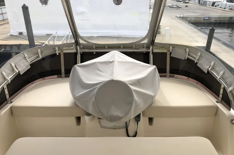 Slide: The Image of Aquila 48 yacht helm station, covered and docked, 2016 model. - 12