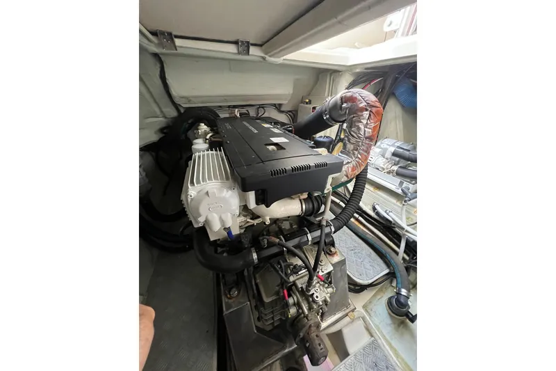 Slide: The Image of Engine compartment of a 2016 Aquila 48 yacht, showcasing mechanical components and wiring. - 30