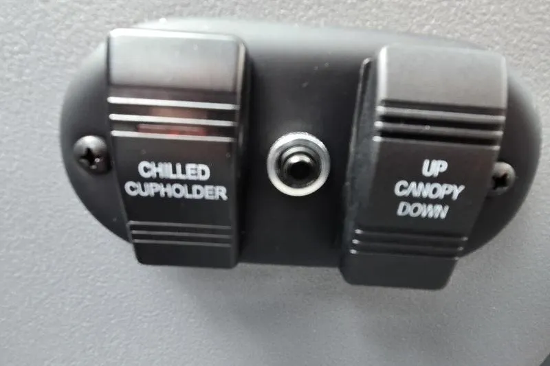 Slide: The Image of Control panel with chilled cupholder and canopy switches on 2026 Godfrey Sweetwater 2286 SB. - 16