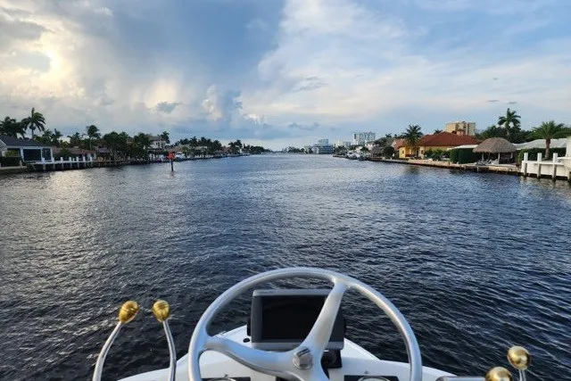 Slide: The Image of Steering view from a 2001 Pursuit 3000 Offshore boat on a scenic waterway. - 8