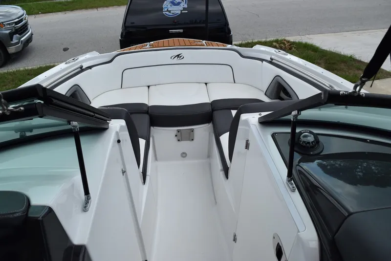 Slide: The Image of 2018 Monterey M-45 boat interior with white seating and black accents. - 6