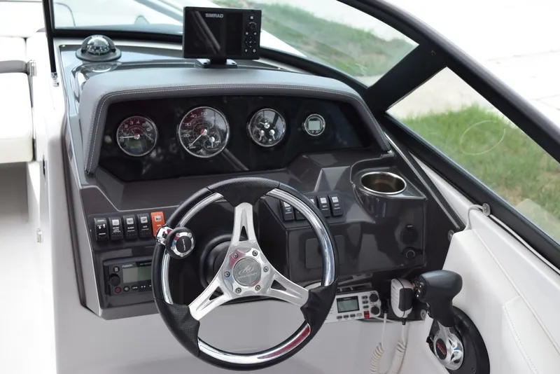 Slide: The Image of Cockpit of 2018 Monterey M-45 boat with steering wheel and control panel. - 12